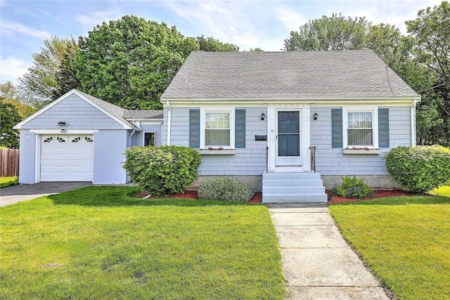 14 Manchester St, Bristol, RI 02809 - cape cod home with a front lawn, asphalt driveway, an attached garage, and roof with shingles
