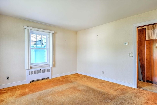 14 Manchester St, Bristol, RI 02809 - unfurnished room featuring radiator, carpet floors, and baseboards