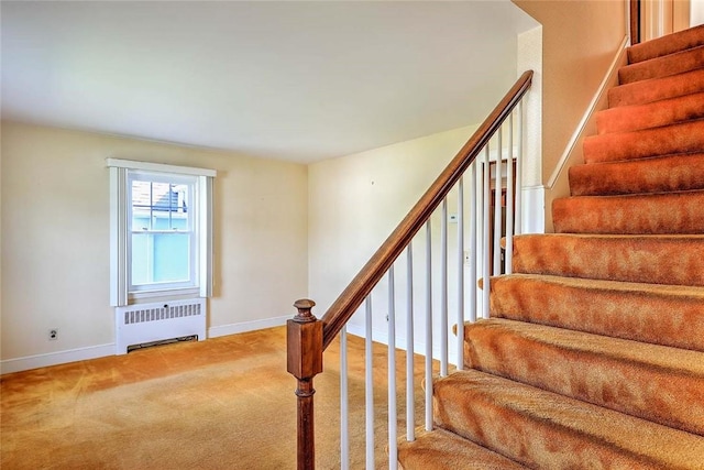 14 Manchester St, Bristol, RI 02809 - staircase with radiator, carpet flooring, and baseboards