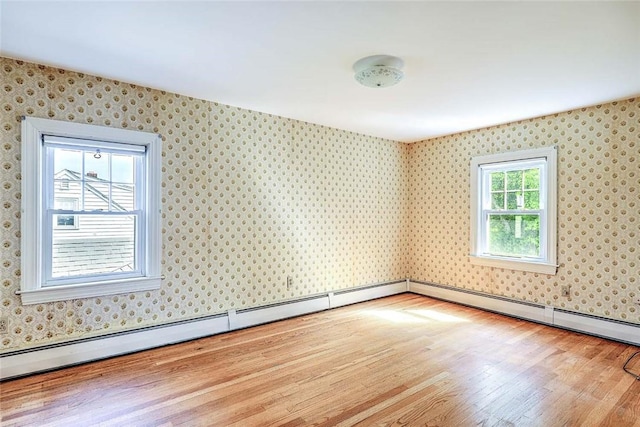 14 Manchester St, Bristol, RI 02809 - empty room featuring wallpapered walls and wood finished floors