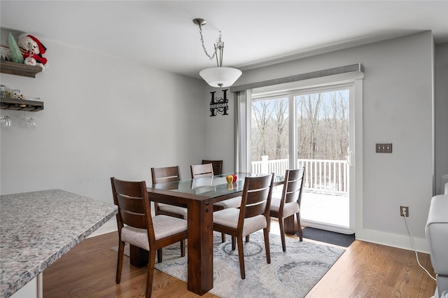 724 Centerville Rd Unit 6, Warwick, RI 02886 - dining area featuring wood finished floors and baseboards