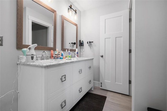 724 Centerville Rd Unit 6, Warwick, RI 02886 - full bath with wood finished floors and double vanity