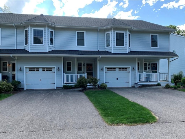 724 Centerville Rd Unit 6, Warwick, RI 02886 - view of property with a porch, a garage, and driveway