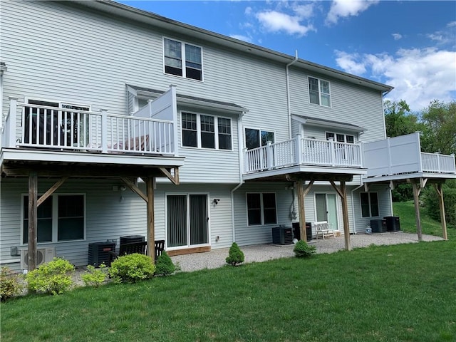 724 Centerville Rd Unit 6, Warwick, RI 02886 - back of property featuring a yard, central AC, and a patio