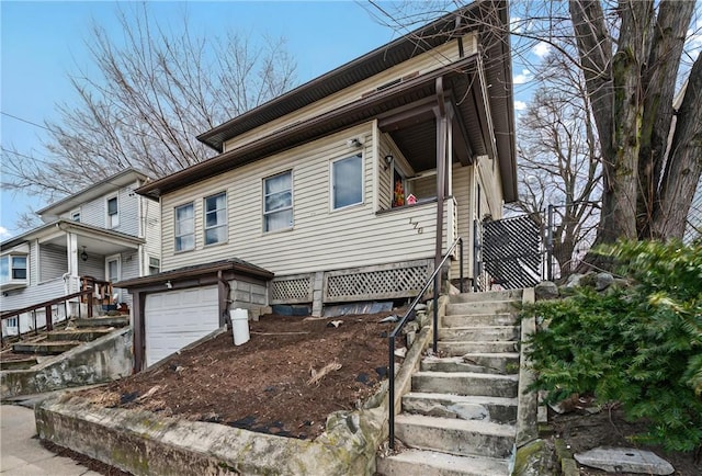 176 Warwick Ave, Cranston, RI 02905 - view of front of house featuring stairway and an attached garage