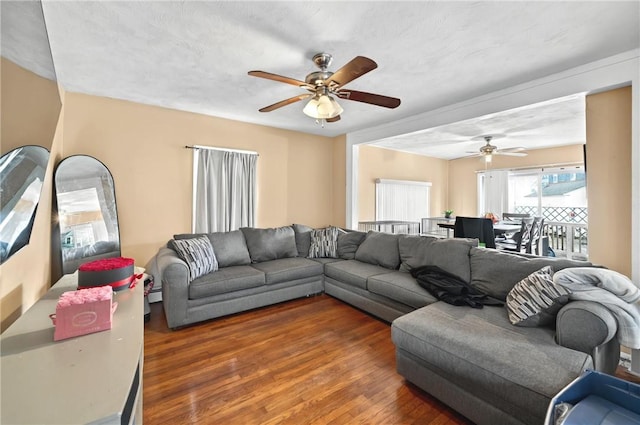 176 Warwick Ave, Cranston, RI 02905 - living area with ceiling fan, wood finished floors, and a baseboard radiator