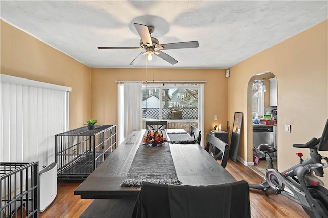 176 Warwick Ave, Cranston, RI 02905 - dining area with ceiling fan, wood finished floors, and arched walkways