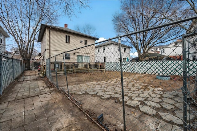 176 Warwick Ave, Cranston, RI 02905 - back of house with a fenced backyard and a chimney