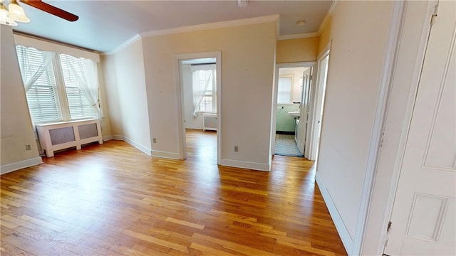 45 Ayrault Ave Unit 8, Newport, RI 02840 - spare room featuring radiator, light wood finished floors, a ceiling fan, crown molding, and baseboards