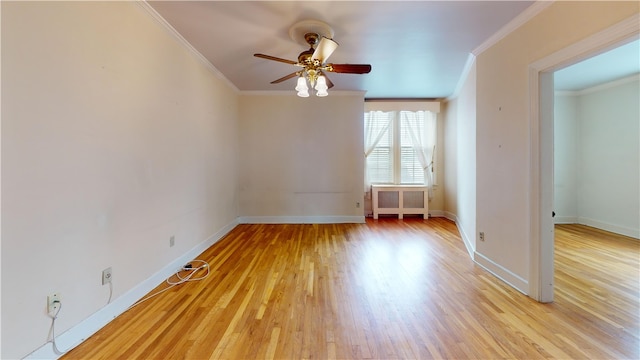 45 Ayrault Ave Unit 8, Newport, RI 02840 - spare room with ornamental molding, ceiling fan, light wood-style floors, baseboards, and radiator heating unit