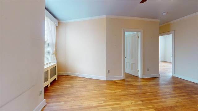 45 Ayrault Ave Unit 8, Newport, RI 02840 - unfurnished room with light wood finished floors, crown molding, baseboards, a ceiling fan, and a smoke detector