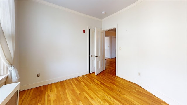 45 Ayrault Ave Unit 8, Newport, RI 02840 - empty room featuring light wood-style floors, crown molding, and baseboards
