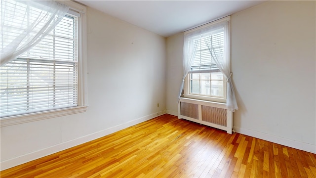 45 Ayrault Ave Unit 8, Newport, RI 02840 - spare room featuring radiator heating unit, light wood finished floors, and baseboards