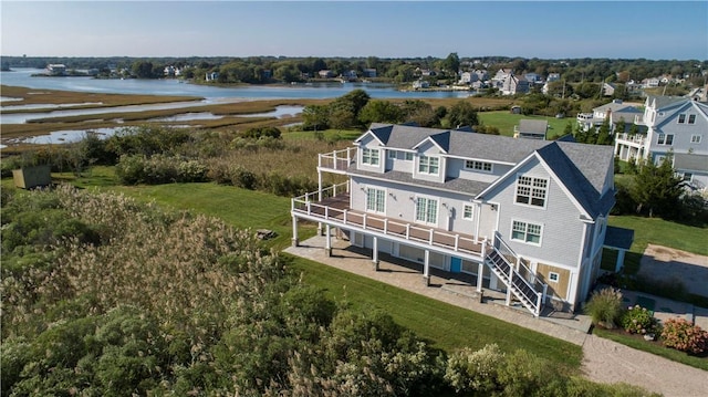32 Breach Dr, Westerly, RI 02891 - back of house with a deck with water view, stairs, and a yard