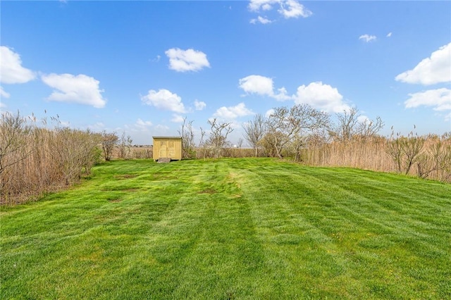 32 Breach Dr, Westerly, RI 02891 - view of green lawn with a storage shed and an outbuilding
