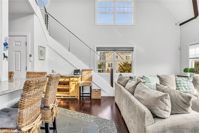 32 Breach Dr, Westerly, RI 02891 - living area with high vaulted ceiling and dark wood-style floors