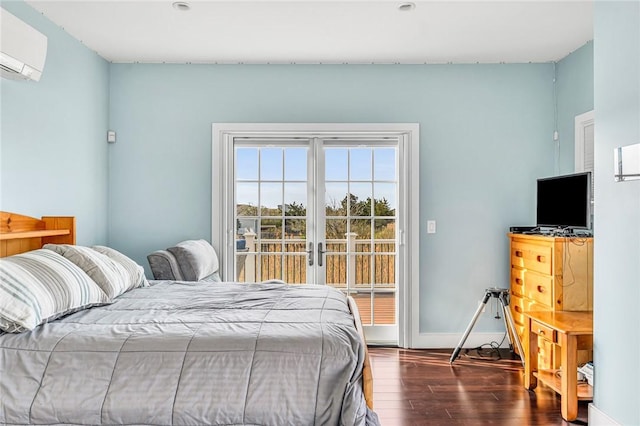 32 Breach Dr, Westerly, RI 02891 - bedroom with wood finished floors, a wall mounted air conditioner, baseboards, and access to outside