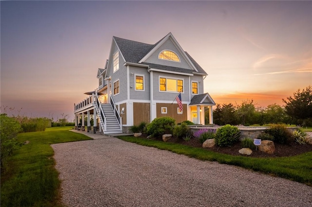 32 Breach Dr, Westerly, RI 02891 - view of front of home with stairway, a yard, and driveway