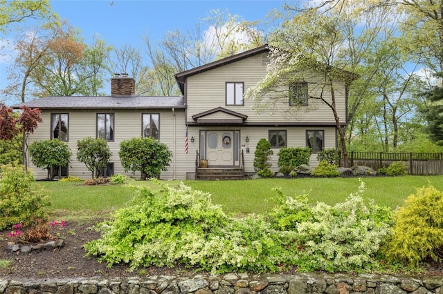 218 Burnt Cedar Dr, North Kingstown, RI 02852 - view of front of home with a chimney