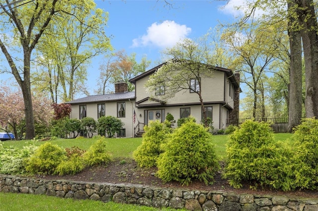 218 Burnt Cedar Dr, North Kingstown, RI 02852 - view of front of home featuring a chimney