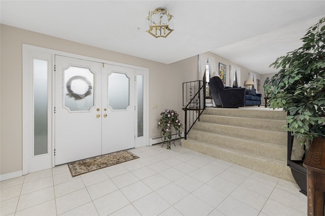 218 Burnt Cedar Dr, North Kingstown, RI 02852 - foyer with stairs, a baseboard radiator, light tile patterned floors, and baseboards