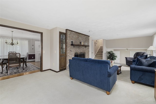 218 Burnt Cedar Dr, North Kingstown, RI 02852 - living room with a brick fireplace, stairs, light colored carpet, a chandelier, and baseboards