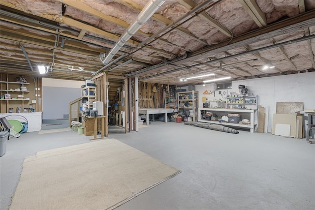 218 Burnt Cedar Dr, North Kingstown, RI 02852 - unfinished below grade area with a workshop area