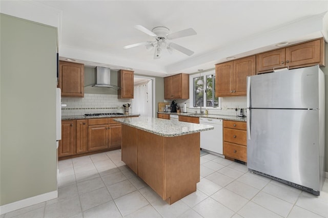 218 Burnt Cedar Dr, North Kingstown, RI 02852 - kitchen featuring appliances with stainless steel finishes, wall chimney range hood, a sink, and tasteful backsplash