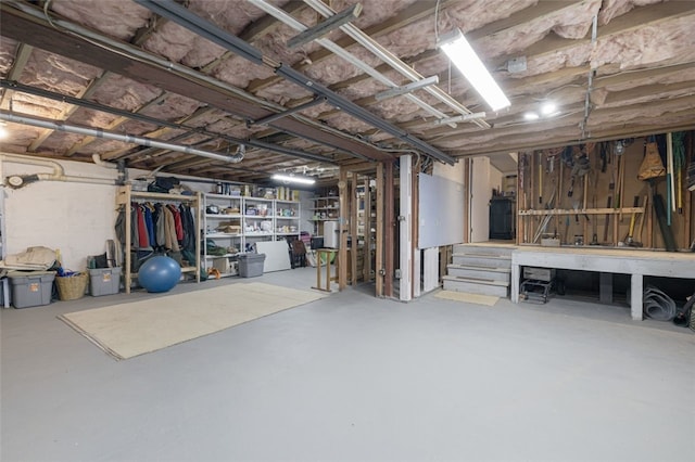 218 Burnt Cedar Dr, North Kingstown, RI 02852 - unfinished below grade area with a workshop area