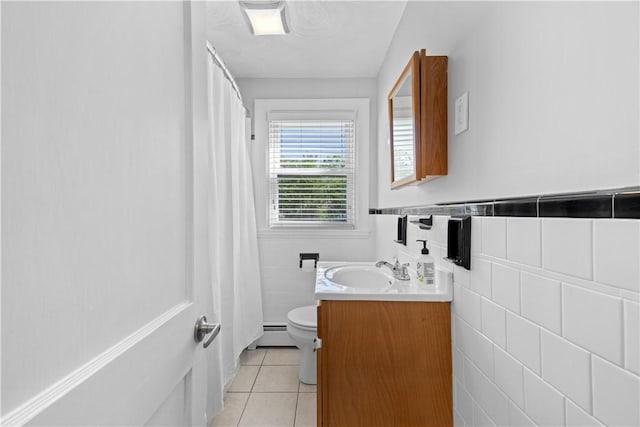 full bath with toilet, tile patterned flooring, a baseboard radiator, tile walls, and vanity