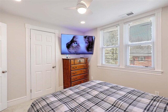 carpeted bedroom featuring a ceiling fan and recessed lighting