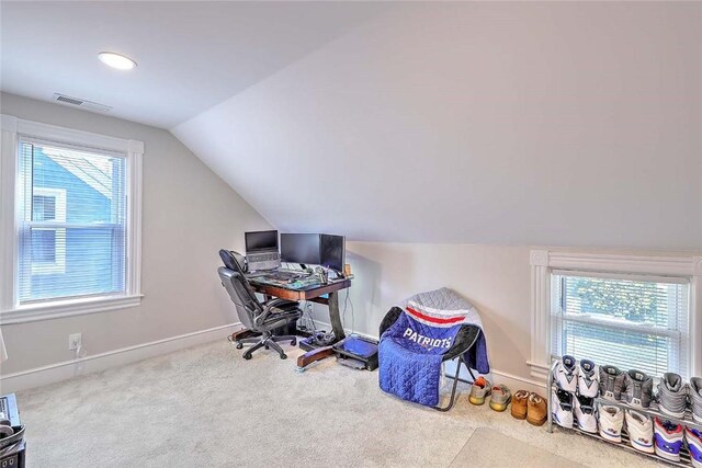 office with lofted ceiling, carpet flooring, and baseboards
