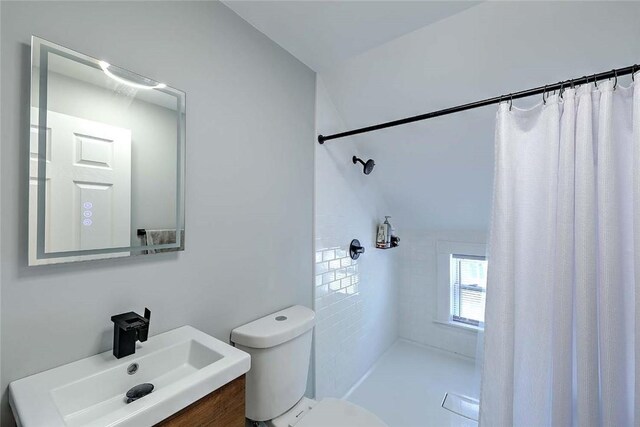 full bath with a shower with curtain, toilet, and vanity
