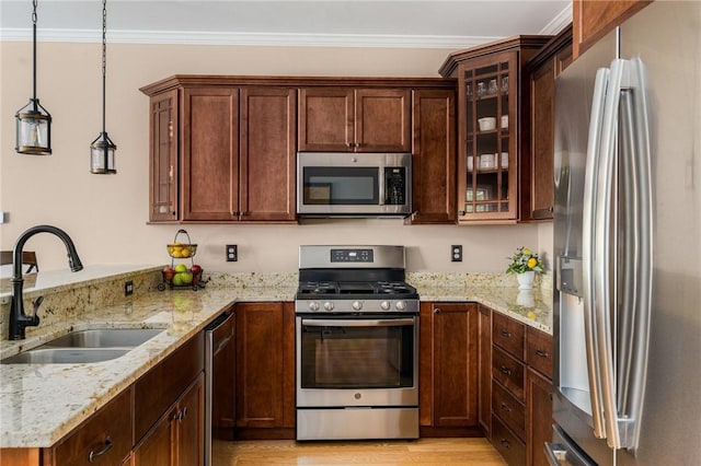 16 Kimberly Ct, North Kingstown, RI 02852 - kitchen with stainless steel appliances, a sink, a peninsula, light stone counters, and ornamental molding