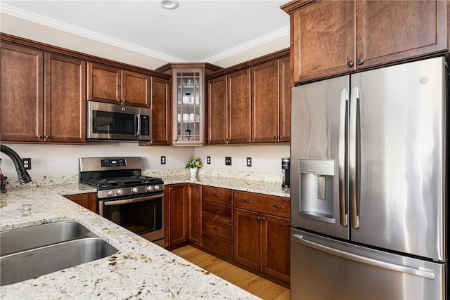 16 Kimberly Ct, North Kingstown, RI 02852 - kitchen with appliances with stainless steel finishes, a sink, light wood-style floors, light stone counters, and glass insert cabinets