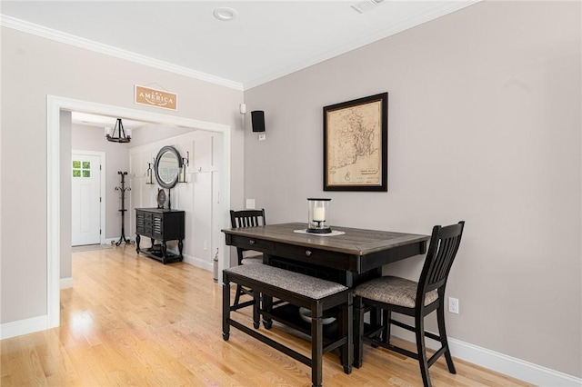 16 Kimberly Ct, North Kingstown, RI 02852 - dining room with ornamental molding, light wood-style flooring, a chandelier, and baseboards