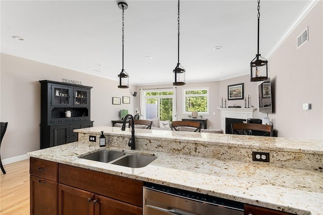16 Kimberly Ct, North Kingstown, RI 02852 - kitchen featuring a sink, stainless steel dishwasher, crown molding, a fireplace, and light wood-style floors