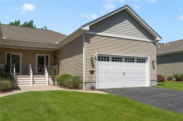 16 Kimberly Ct, North Kingstown, RI 02852 - ranch-style home featuring asphalt driveway, a front lawn, and an attached garage