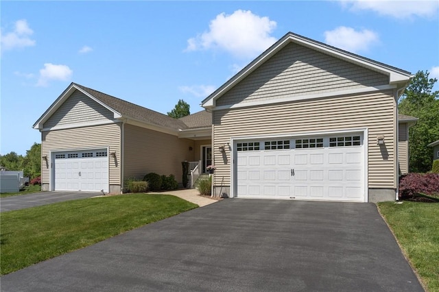 16 Kimberly Ct, North Kingstown, RI 02852 - ranch-style house with asphalt driveway, a garage, and a front lawn