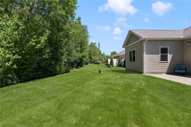 16 Kimberly Ct, North Kingstown, RI 02852 - view of green lawn featuring a patio area