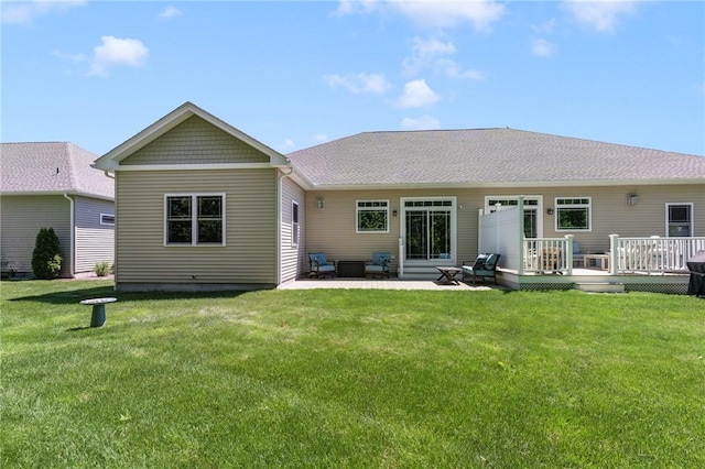 16 Kimberly Ct, North Kingstown, RI 02852 - back of property with a lawn, a deck, and a patio