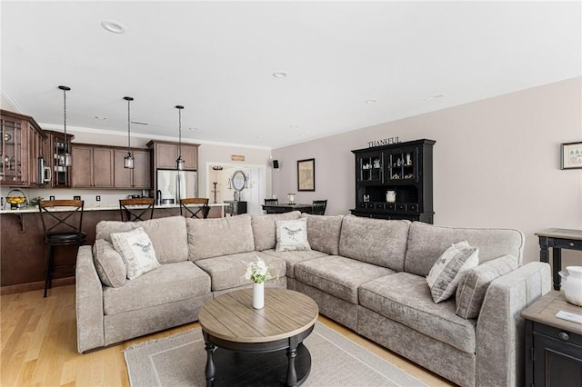 16 Kimberly Ct, North Kingstown, RI 02852 - living area featuring light wood-type flooring, ornamental molding, and recessed lighting