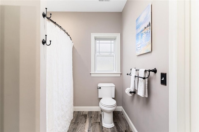 16 Kimberly Ct, North Kingstown, RI 02852 - bathroom with toilet, wood finished floors, baseboards, and a shower with curtain