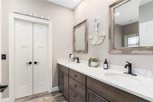 16 Kimberly Ct, North Kingstown, RI 02852 - bathroom with wood finished floors, double vanity, and baseboards