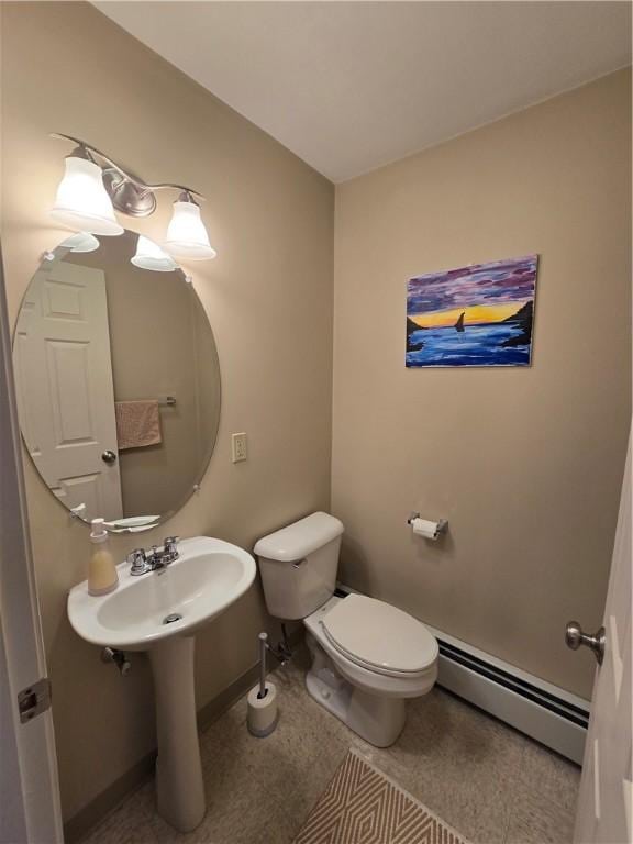 94 Barton St, Pawtucket, RI 02860 - bathroom with a baseboard radiator, toilet, and baseboards