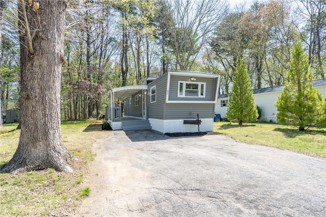 67 Linda Dr, Coventry, RI 02816 - manufactured / mobile home featuring a front lawn and asphalt driveway