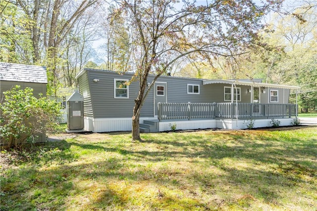 67 Linda Dr, Coventry, RI 02816 - rear view of house featuring a yard and a wooden deck