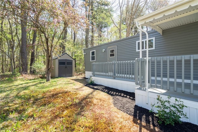 67 Linda Dr, Coventry, RI 02816 - view of yard featuring a shed, an outbuilding, and a wooden deck