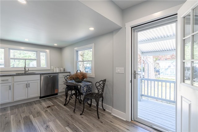 67 Linda Dr, Coventry, RI 02816 - kitchen featuring stainless steel dishwasher, light wood finished floors, baseboards, a sink, and recessed lighting