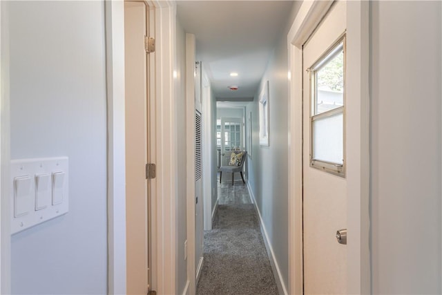67 Linda Dr, Coventry, RI 02816 - hall featuring dark carpet and baseboards